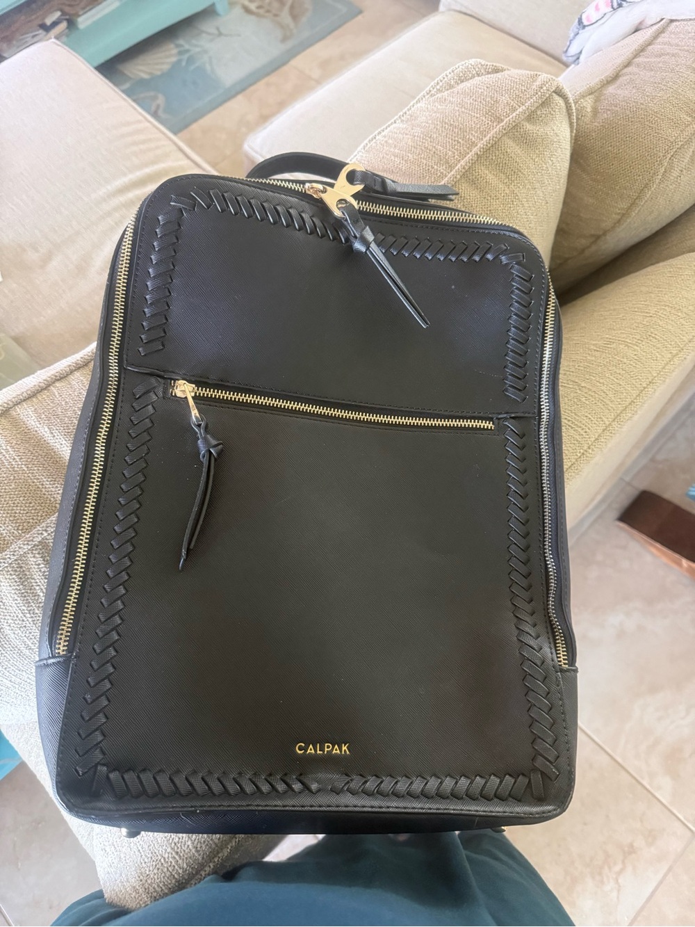 Like new Calpak Black computer Backpack with Gold Accents